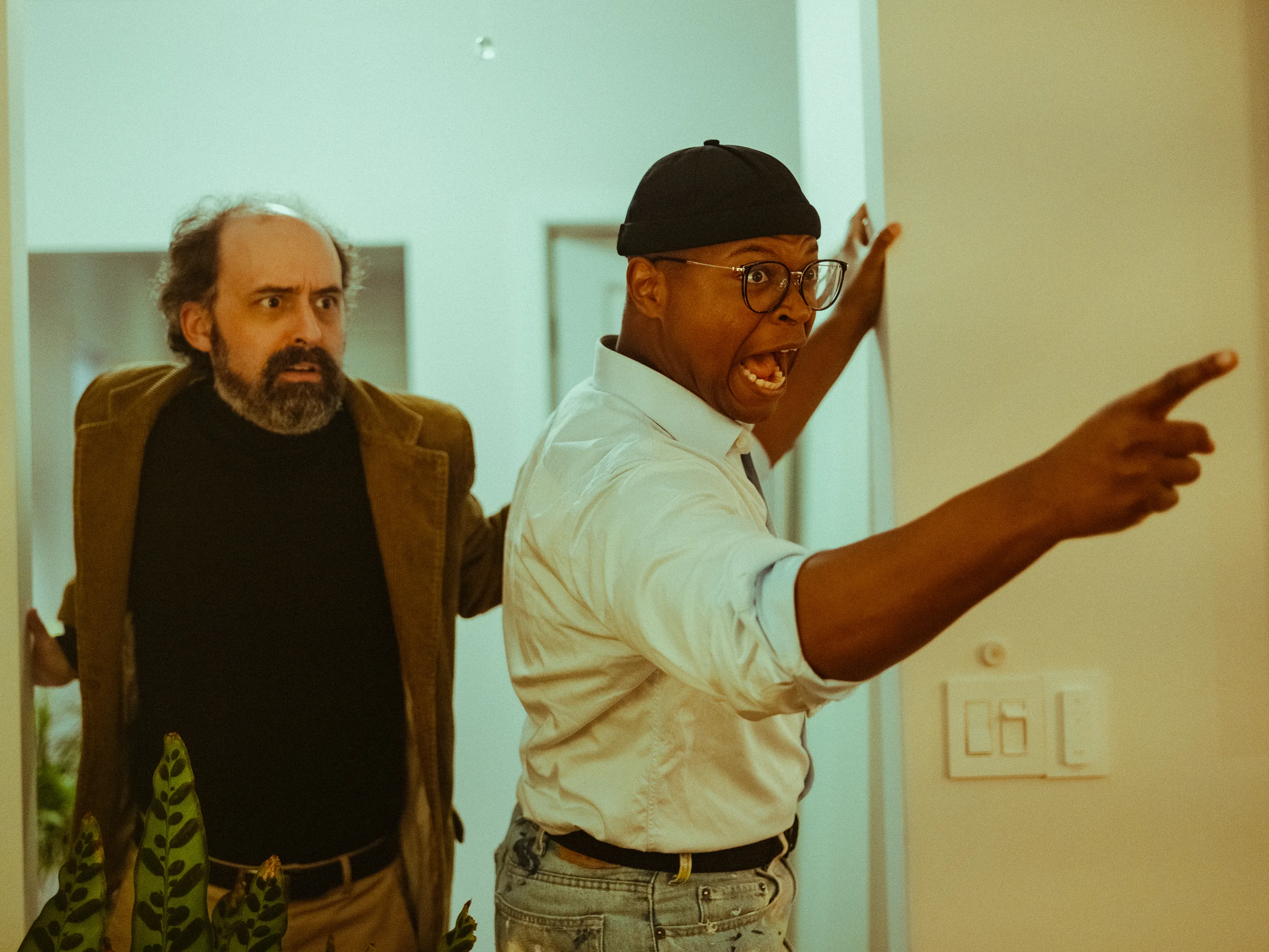Two actors in the middle of an animated performance